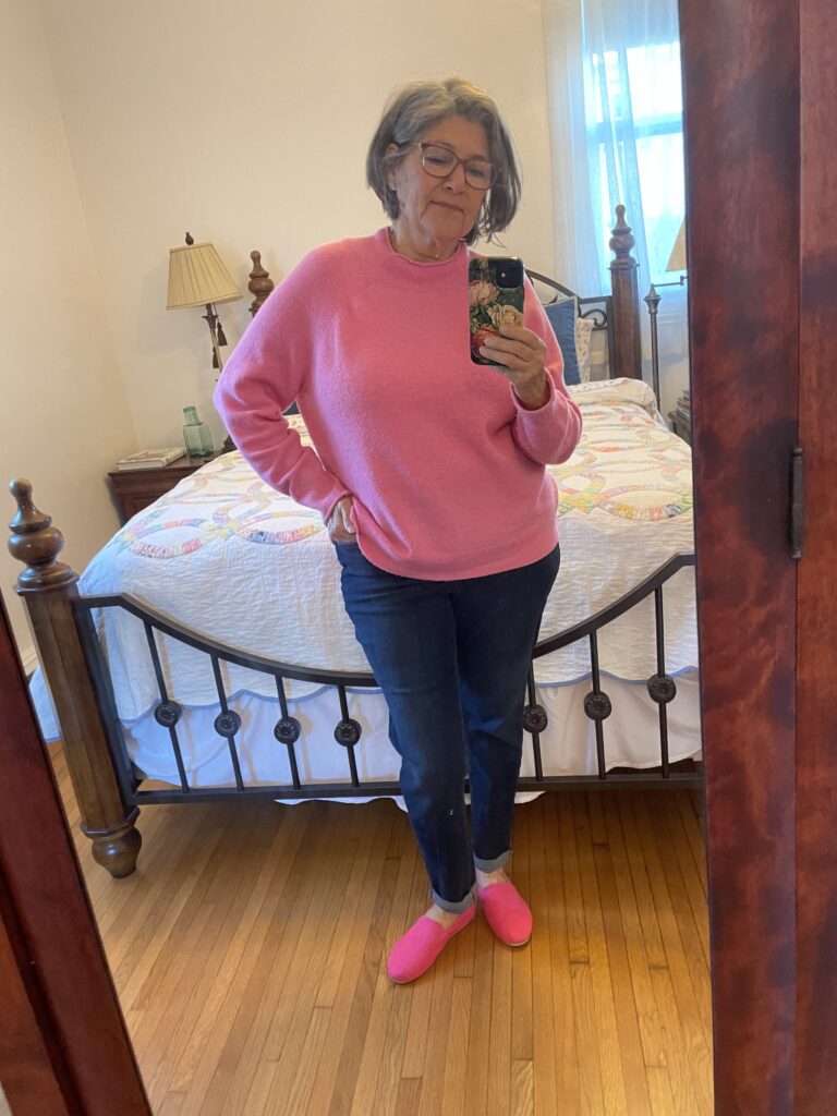 I am wearing dark denim jeans, pink moreno wool sweater and pink Toms