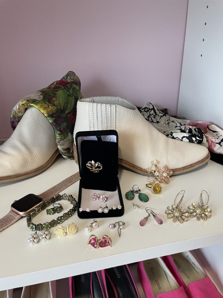 Little floral pink earrings and a variety of Spring jewelry with ivory boots