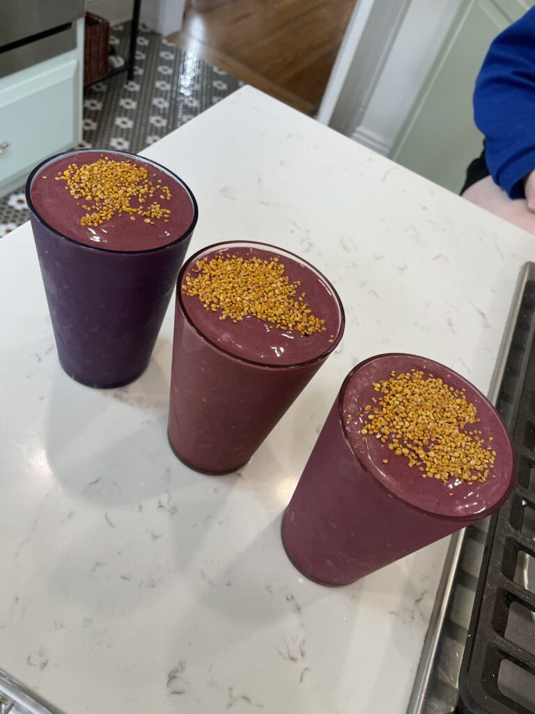 3 blueberry acai smoothies with bee pollen