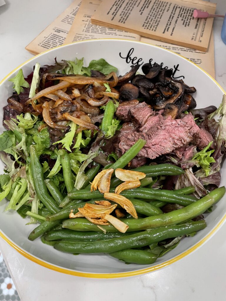 New York steak salad with green beans and toasted garlic