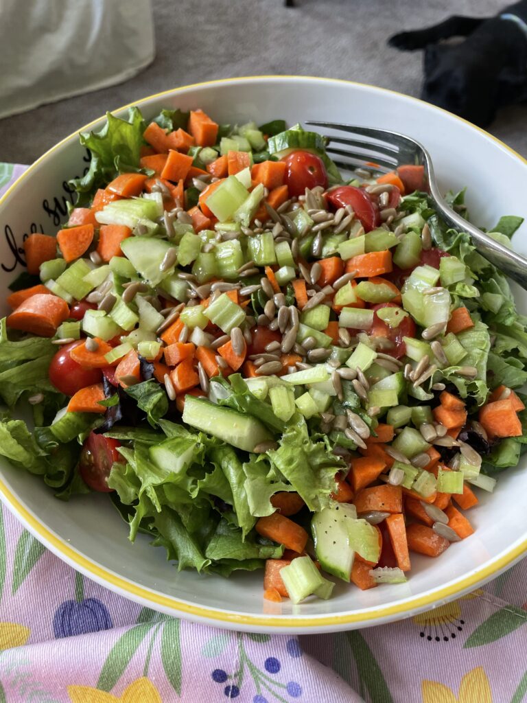 Mixed vegetable salad with raw sunflower seeds