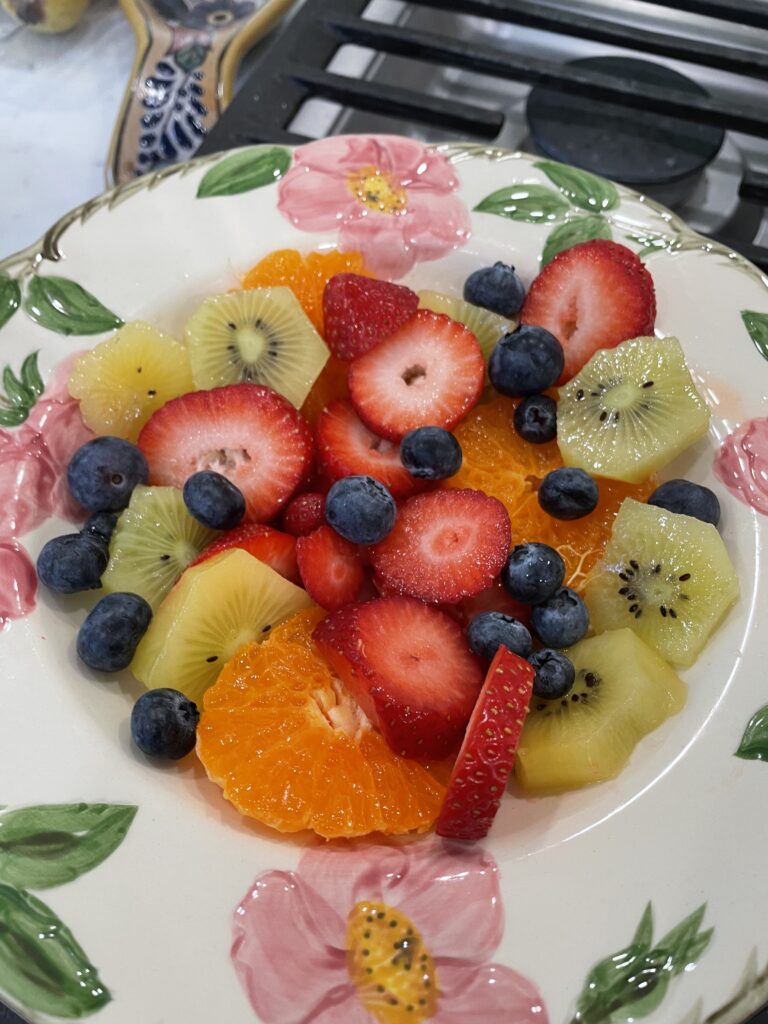 fresh fruit salad with strawberries, blueberries kiwis and oranges